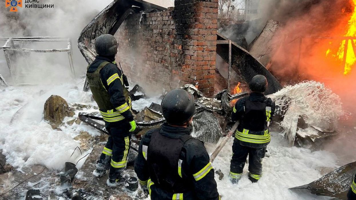 Firefighters work at the site where an industrial area was hit by a Russian missile strike in the Kyiv region on Nov. 13, 2024.
