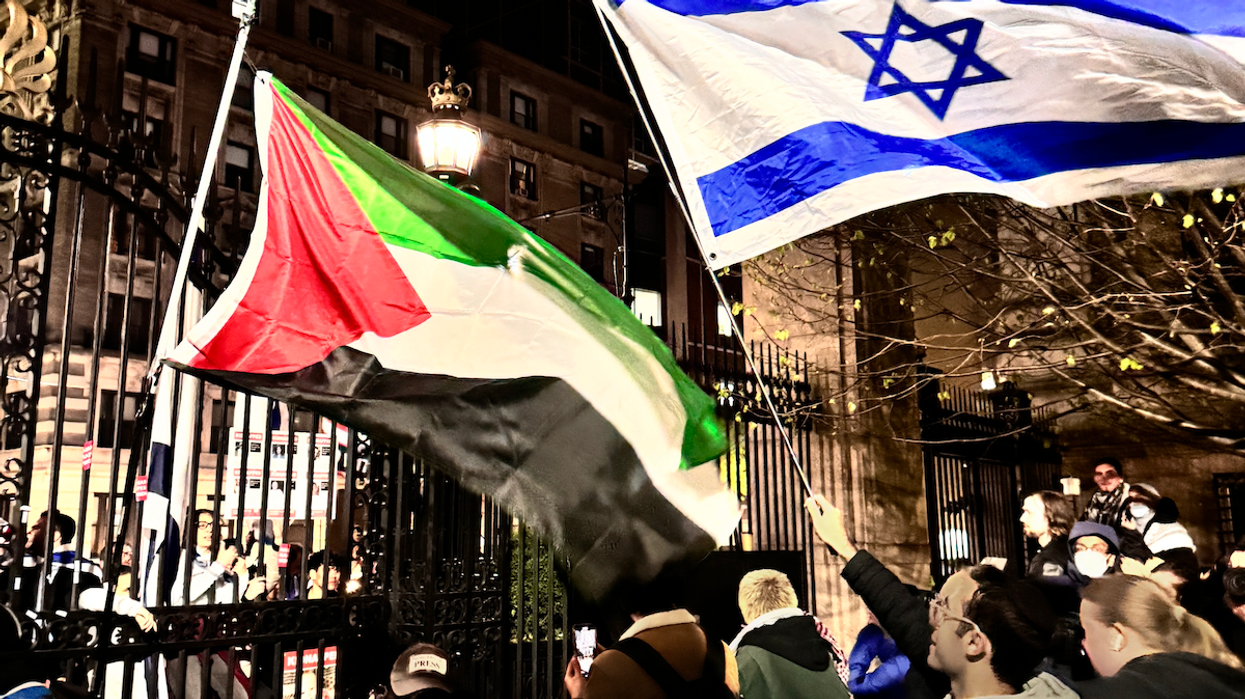 Flags from across the divide wave in the air over protests at Columbia University on Thursday, April 25, 2024.