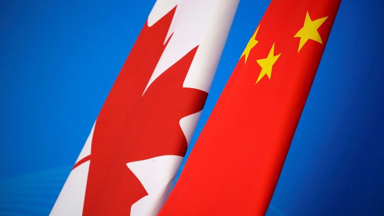Flags of Canada and China.