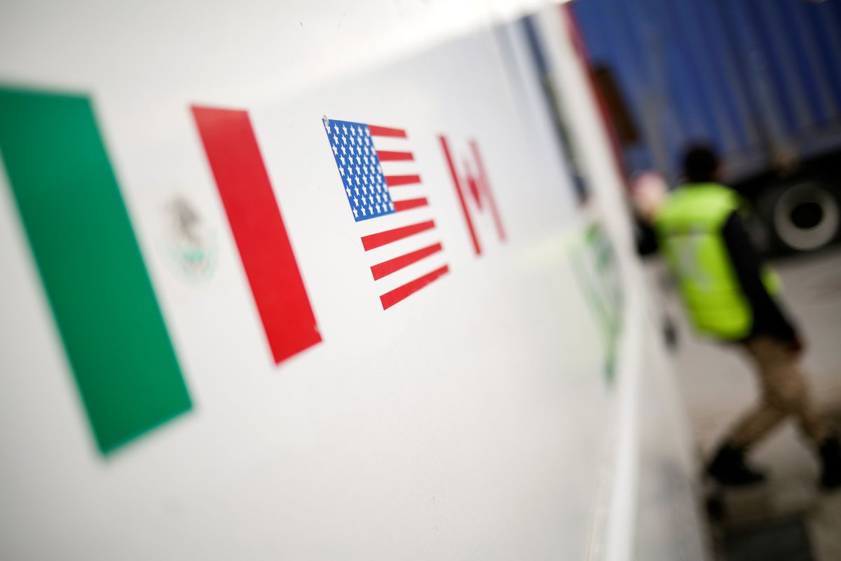 Flags of Mexico, United States, and Canada are pictured at a security booth at Zaragoza-Ysleta border crossing bridge in Ciudad Juarez.