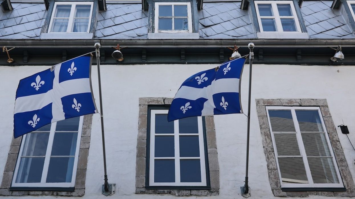 Flags of Quebec are seen on the building in Quebec City, Canada, in 2023.