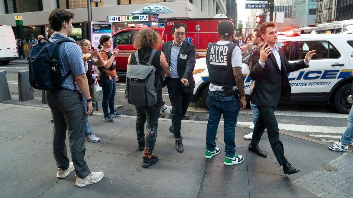 Fleeing office workers run from the scene of an active shooter in Midtown Manhattan, Monday, June 28, 2025, in New York City. 