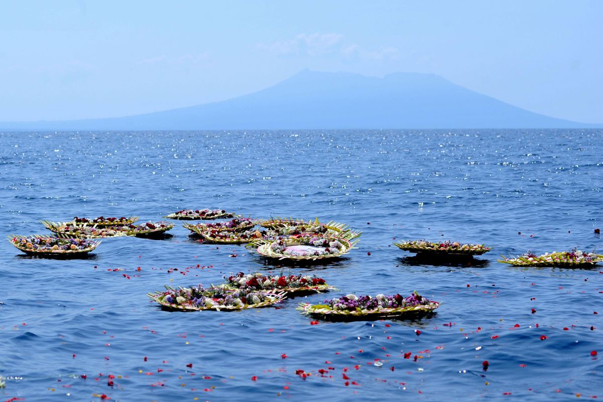 Flowers and petals with names of the sunken KRI Nanggala-402 submarine crew members are seen at the sea near Labuhan Lalang, Bali, Indonesia April 26, 2021