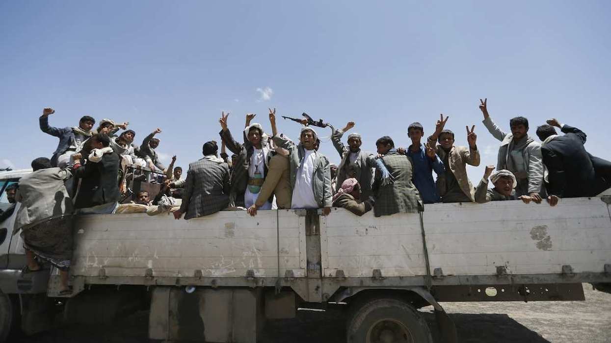 Followers of the Shi'ite Houthi group ride on a truck at a gathering near the Yemeni capital Sanaa August 20, 2014.
