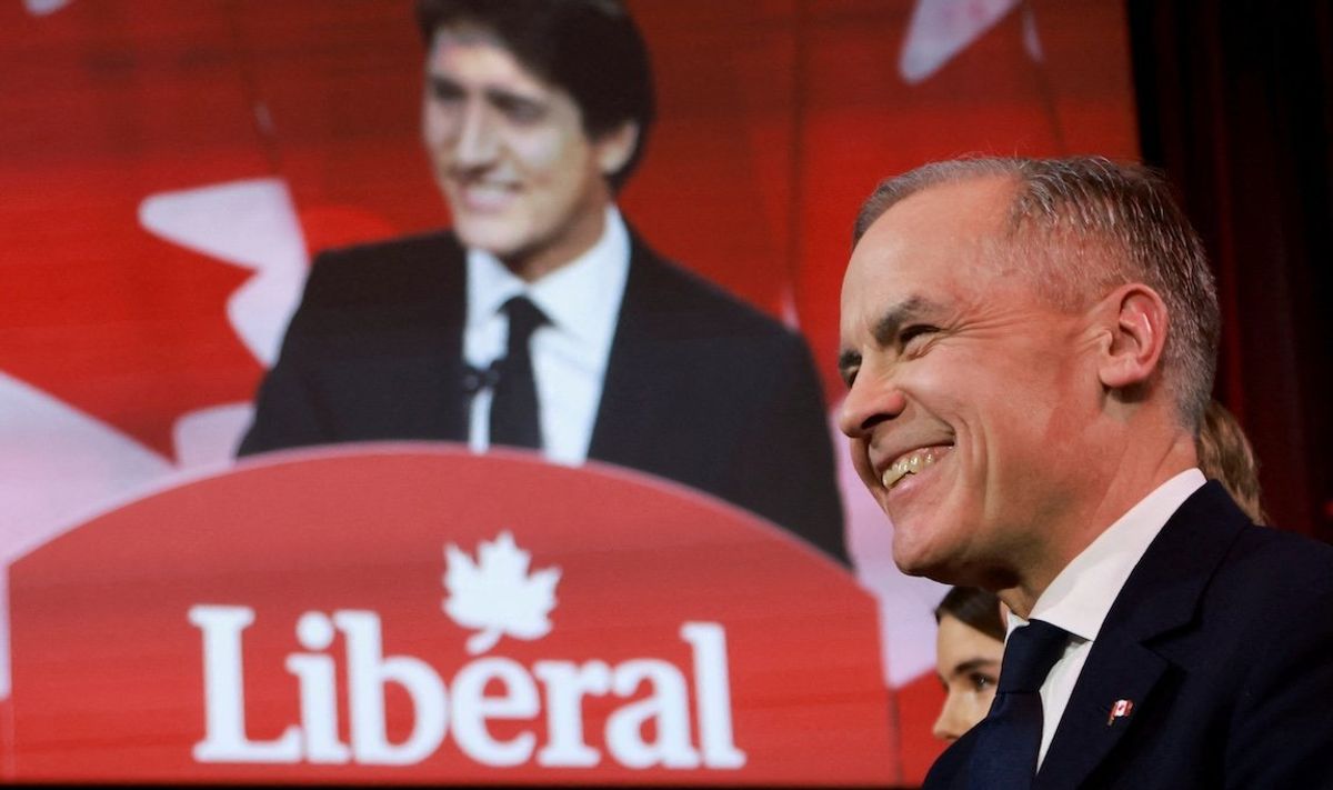 Former Bank of Canada and Bank of England Governor Mark Carney listens to outgoing Prime Minister Justin Trudeau's speech just before being elected to succeed Trudeau as Liberal Party leader on Sunday, March 9, in Ottawa, Canada.