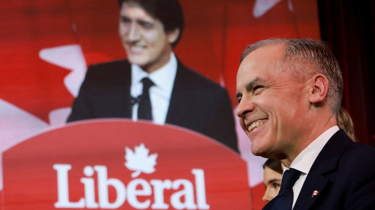 Former Bank of Canada and Bank of England Governor Mark Carney listens to outgoing Prime Minister Justin Trudeau's speech just before being elected to succeed Trudeau as Liberal Party leader on Sunday, March 9, in Ottawa, Canada.