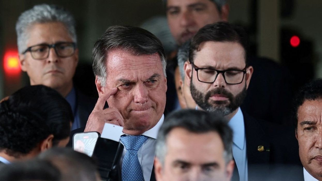 Former Brazilian President Jair Bolsonaro walks on March 26, 2025, after the Supreme Court ruled that he must stand trial.