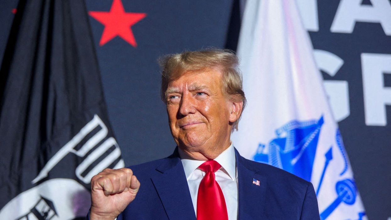 Former President and Republican candidate Donald Trump greets the crowd during a campaign rally in Windham, New Hampshire, on Aug. 8, 2023. 