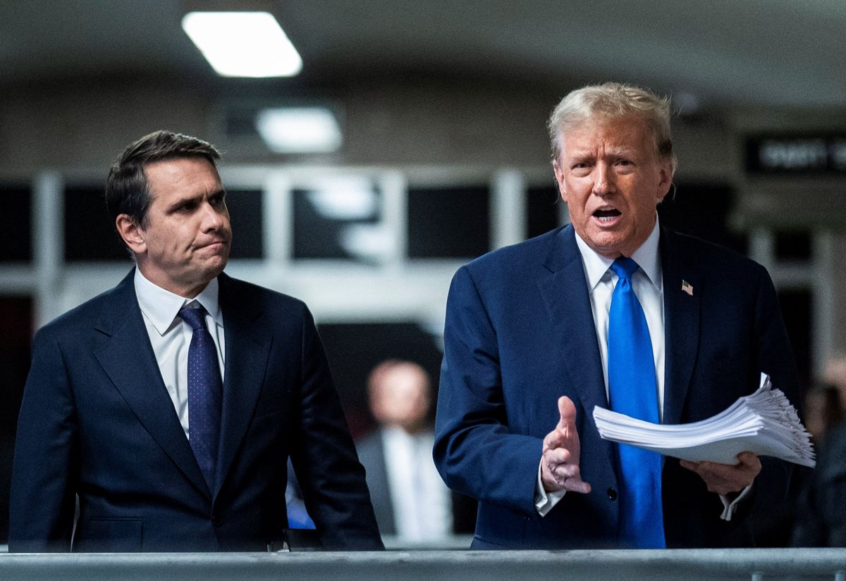 ​Former President Donald Trump speaks to reporters with attorney Todd Blanche at the end of the day at Manhattan criminal court as jury selection continues in New York, U.S., April 18, 2024. 