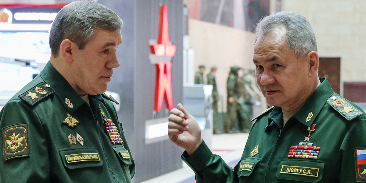 ​Former Russian Defence Minister Sergei Shoigu and Chief of the General Staff of Russian Armed Forces Valery Gerasimov talk in December 2023. Both men now face ICC warrants for alleged war crimes.