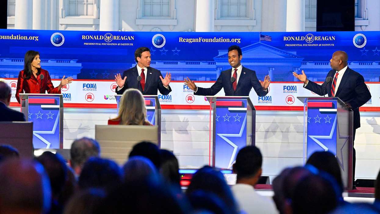 Former South Carolina Gov. Nikki Haley, Florida Gov. Ron DeSantis, businessman Vivek Ramaswamy and South Carolina Sen. Tim Scott speak during the FOX Business Republican presidential primary debate at the Ronald Reagan Presidential Library and Museum.