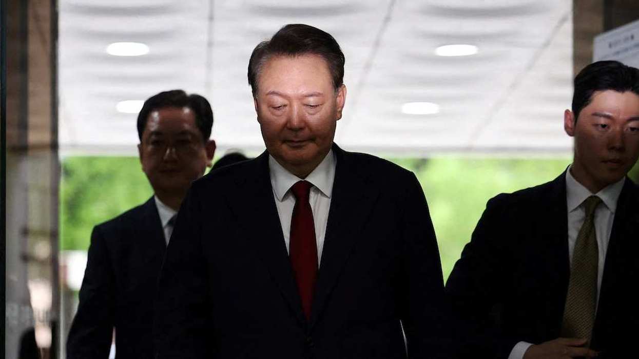 Former South Korean President Yoon Suk Yeol arrives at a court to attend a hearing to review his arrest warrant requested by special prosecutors in Seoul, South Korea, July 9, 2025.