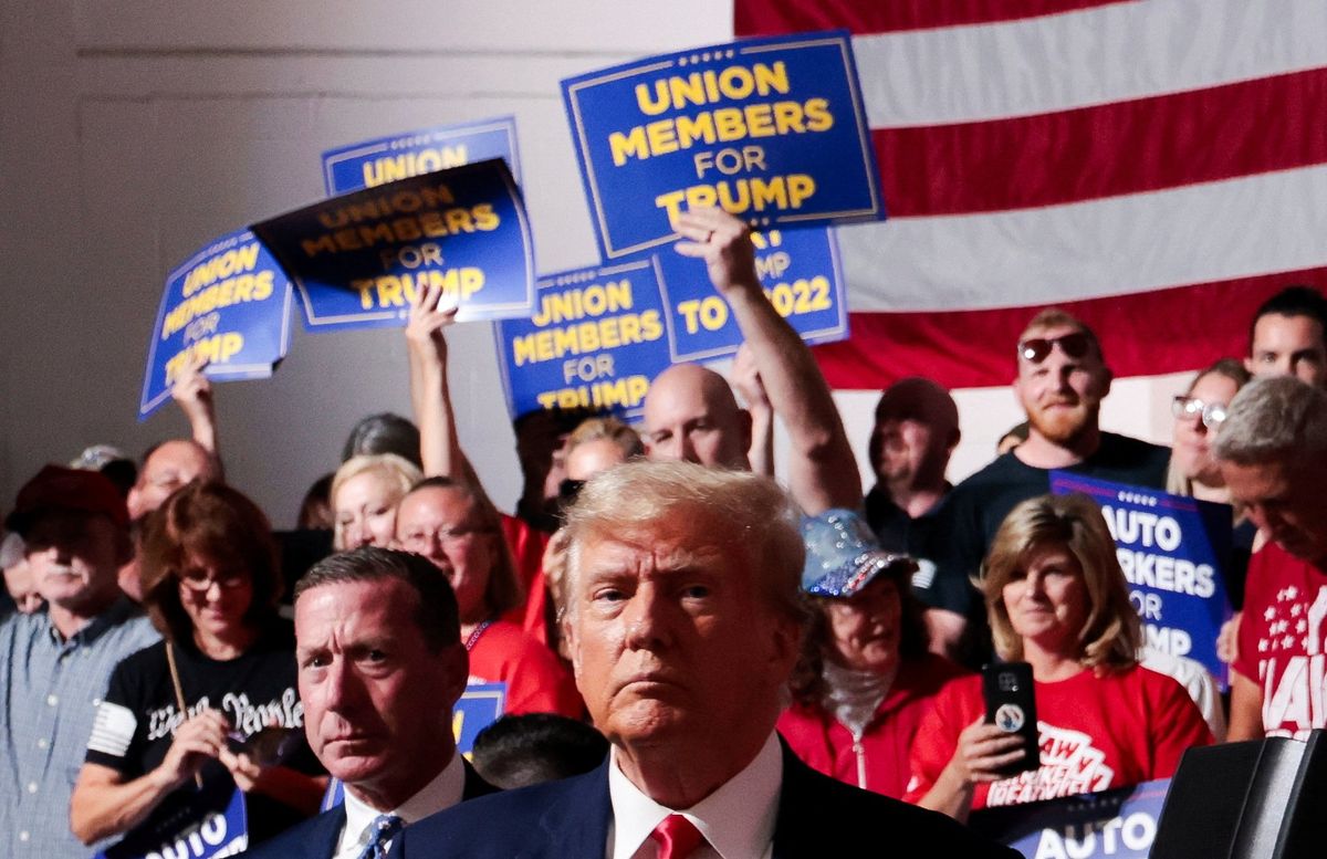 Former U.S. President and Republican presidential candidate Donald Trump looks on while his supporters cheer on the day he addresses auto workers as he skips the second GOP debate, in Clinton Township, Michigan, U.S., September 27, 2023.