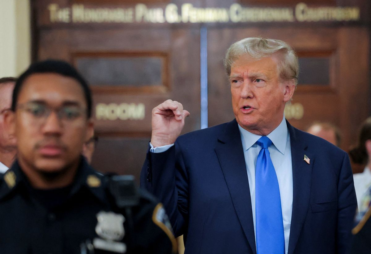 Former U.S. President Donald Trump gestures as he makes a statement to the media outside the court room at a Manhattan courthouse, during the trial of himself, his adult sons, the Trump Organization and others in a civil fraud case brought by state Attorney General Letitia James, in New York City, U.S., October 2, 2023. 