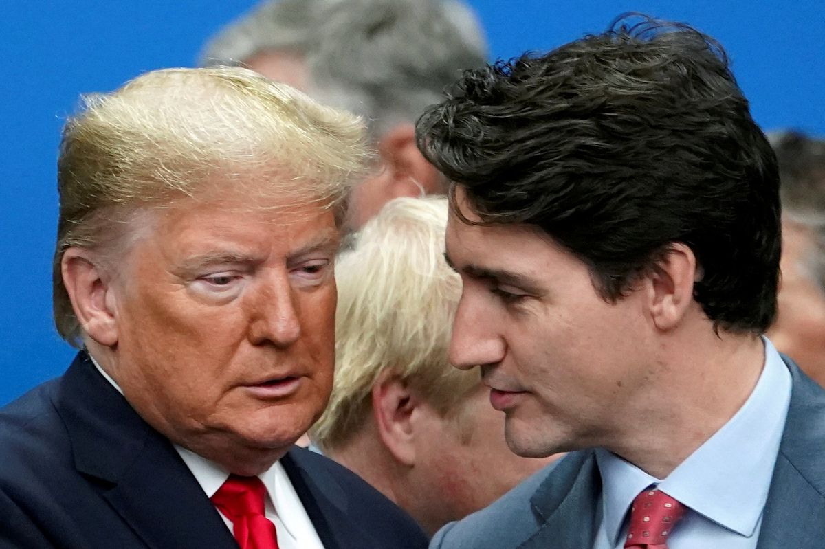 Former US President Donald Trump talks with Canada's Prime Minister Justin Trudeau. 