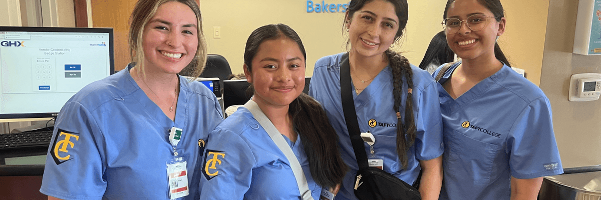 Four interns standing in a hospital lobby