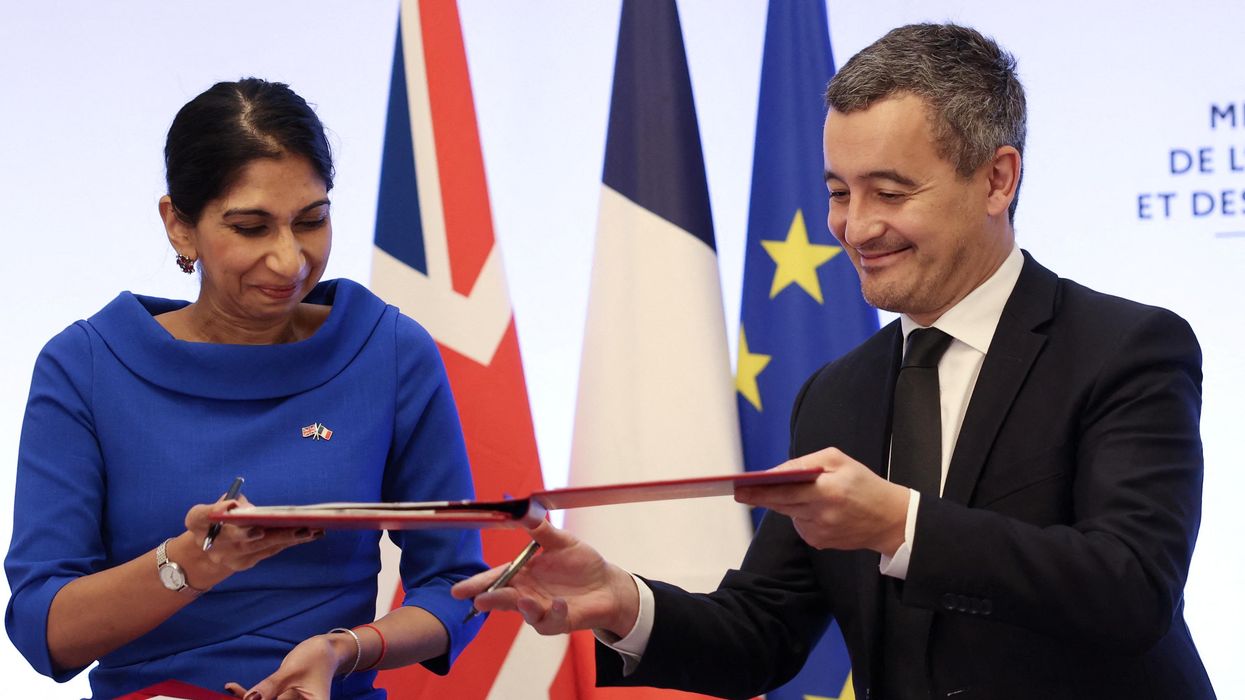 French Interior Minister Gerald Darmanin and UK Home Secretary Suella Braverman sign a joint declaration on migrants in Paris.