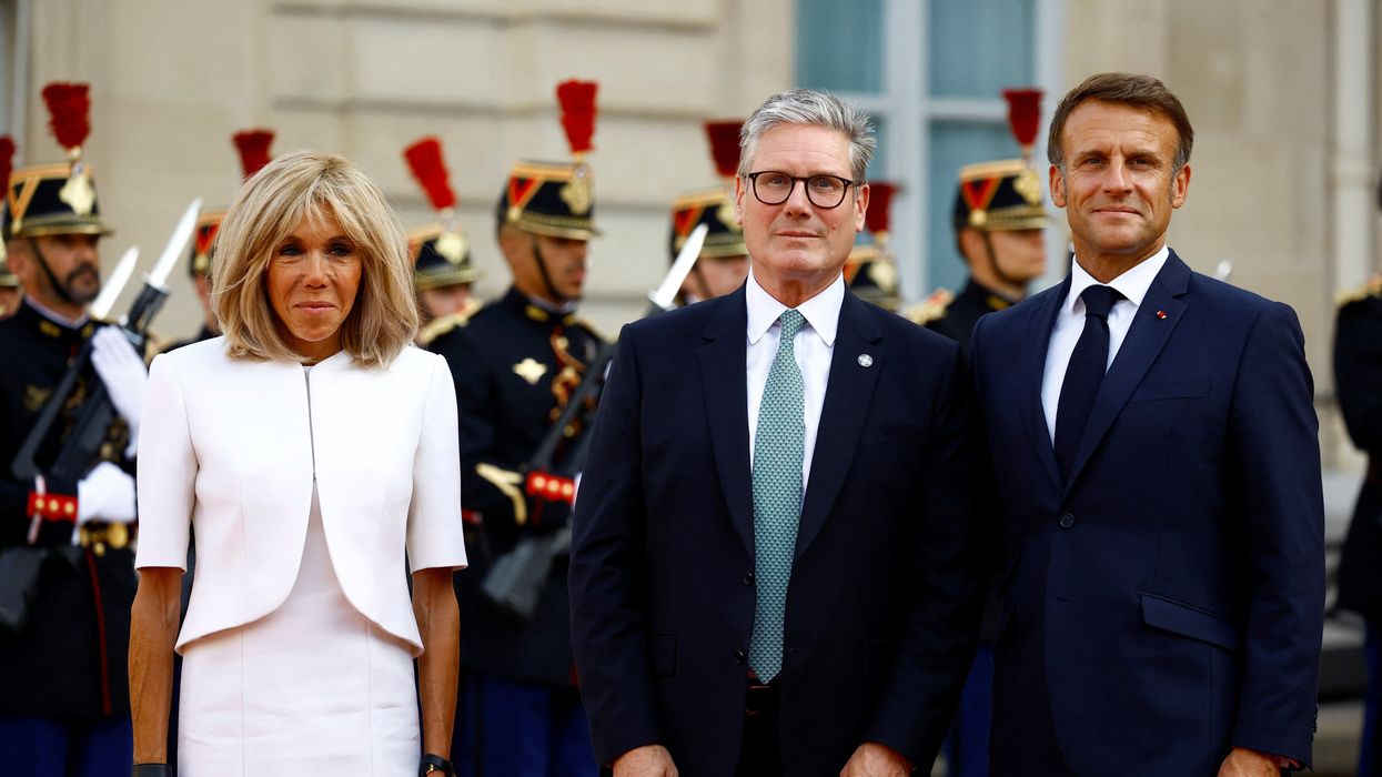 French President Emmanuel Macron and his wife Brigitte Macron welcome Britain's Prime Minister Keir Starmer as he arrives to attend a reception for heads of state and government at the Elysee Palace before the opening ceremony of the Paris 2024 Paralympic Games, in Paris, France August 28, 2024.