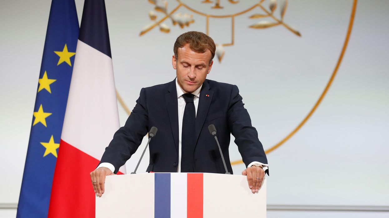 French President Emmanuel Macron delivers a speech during a ceremony in memory of the Harkis, Algerians who helped the French Army in the Algerian War of Independence, at the Elysee Palace in Paris, France, September 20, 2021.