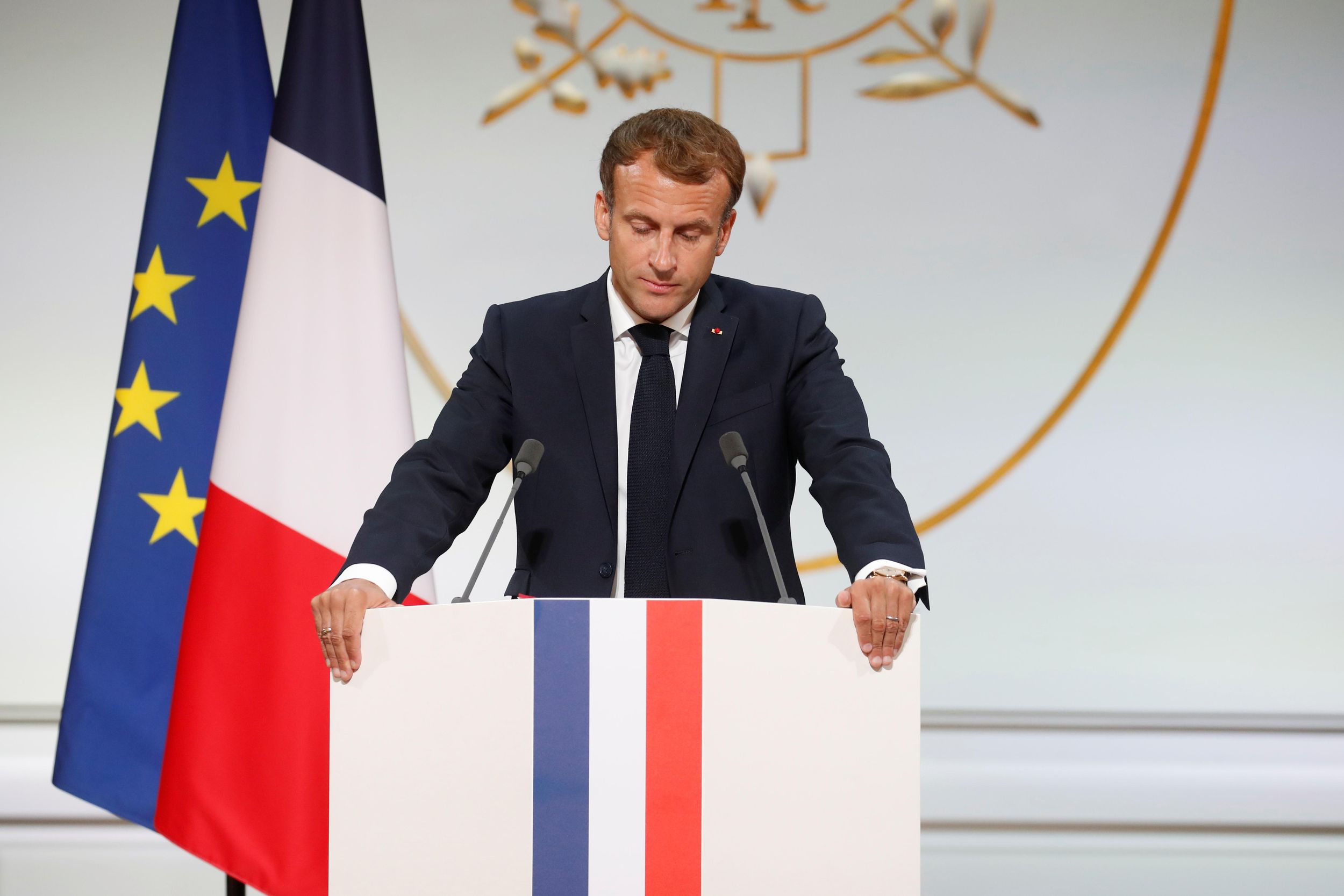 French President Emmanuel Macron delivers a speech during a ceremony in memory of the Harkis, Algerians who helped the French Army in the Algerian War of Independence, at the Elysee Palace in Paris, France, September 20, 2021.