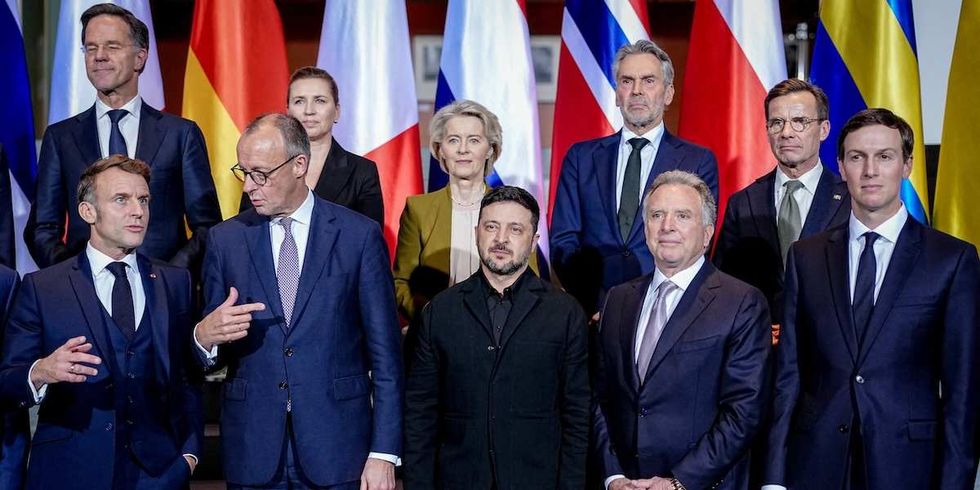 French President Emmanuel Macron, German Chancellor Friedrich Merz, Ukrainian President Volodymyr Zelenskiy, U.S. Special Envoy Steve Witkoff and businessman Jared Kushner, along with NATO Secretary-General Mark Rutte and otherEuropean leaders, pose for a group photo at the Chancellery in Berlin, Germany, December 15, 2025.