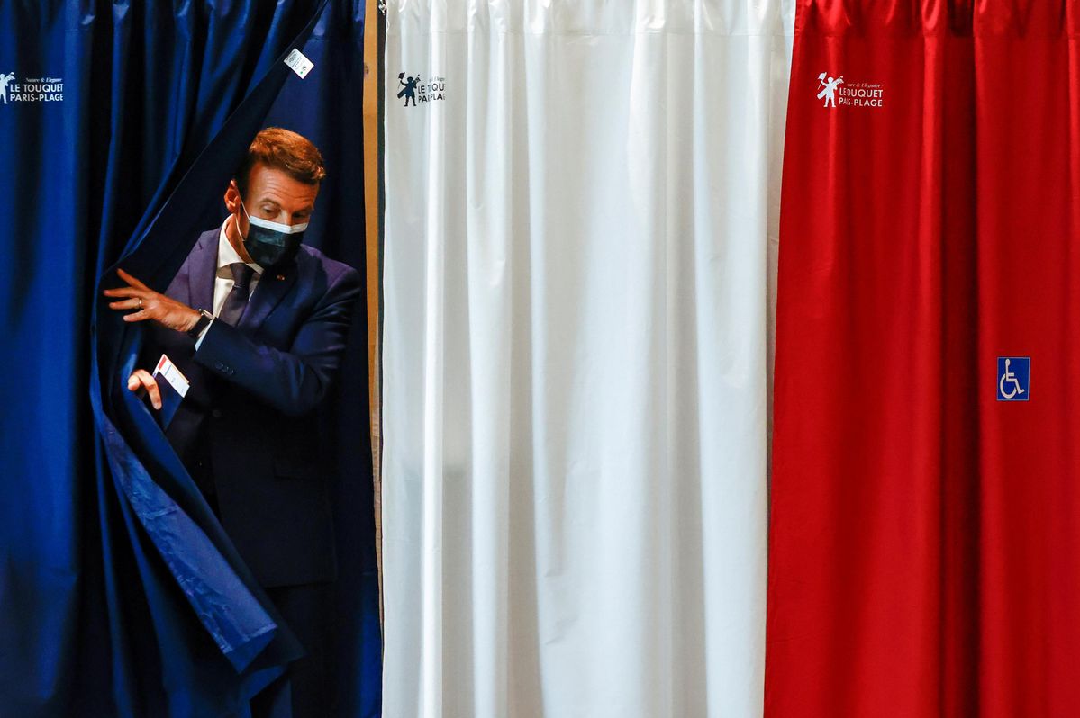 French President Emmanuel Macron is seen at a polling station during the first round of French regional and departmental elections, in Le Touquet-Paris-Plage, France June 20, 2021. 