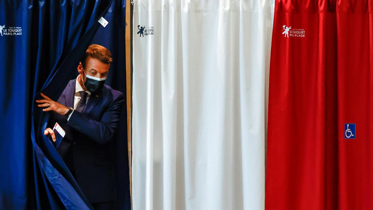 French President Emmanuel Macron is seen at a polling station during the first round of French regional and departmental elections, in Le Touquet-Paris-Plage, France June 20, 2021.