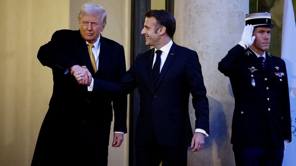 French President Emmanuel Macron shakes hands with US President-elect Donald Trump as he arrives for a meeting at the Elysee Palace in Paris as part of ceremonies to mark the reopening of the Notre-Dame de Paris Cathedral, in Paris, on Dec. 7, 2024.