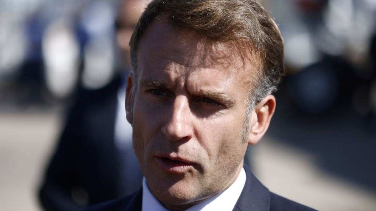 French President Emmanuel Macron speaks to the members of the media, after arriving by plane to attend the Gaza Peace Summit, in Sharm el-Sheikh, Egypt, October 13, 2025.