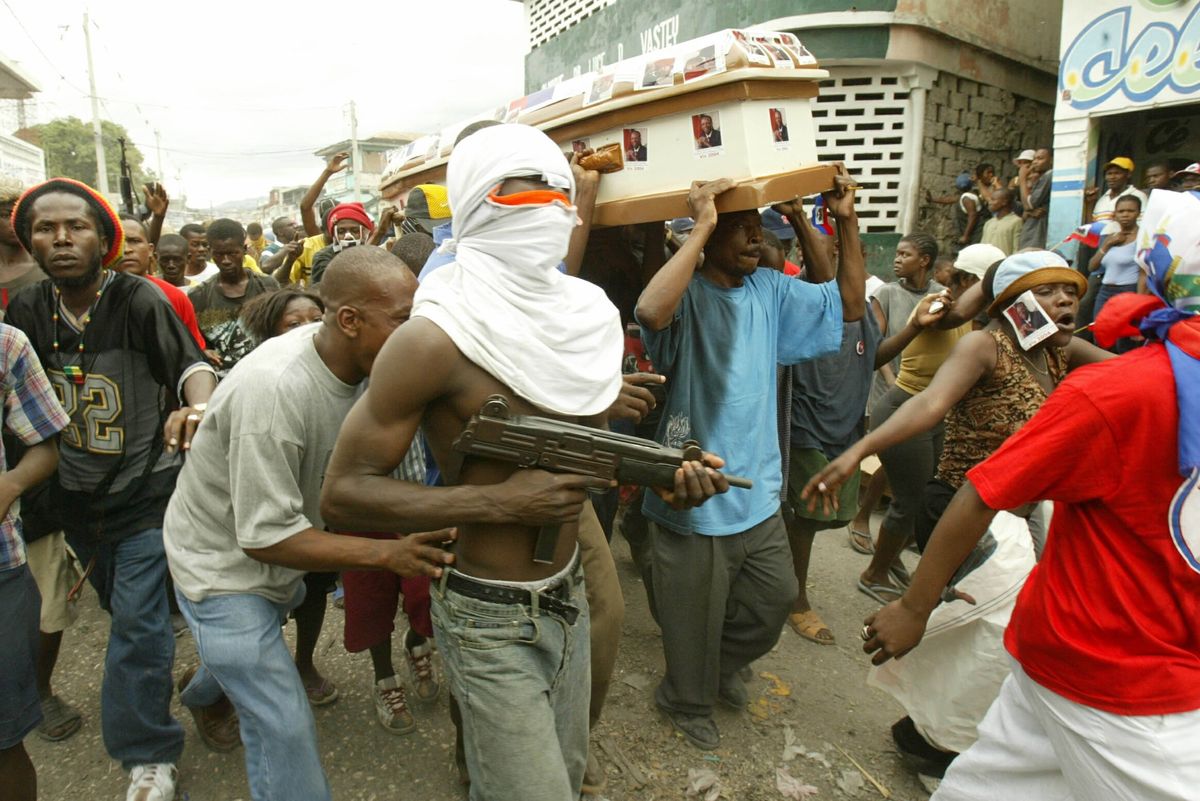 ​Gang member in carrying gun in Haiti