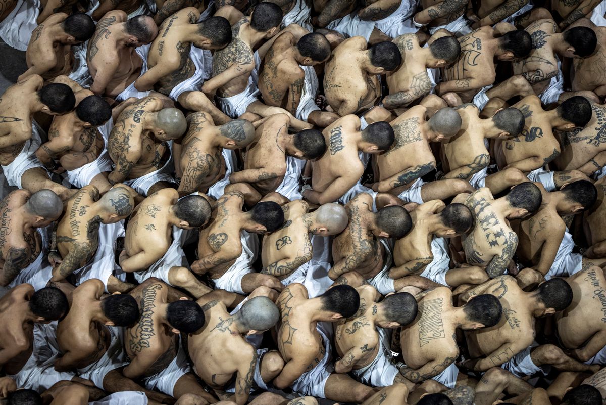 Gang members wait to be taken to their cell after 2000 gang members were transferred to the Terrorism Confinement Center, in Tecoluca, El Salvador. Handout distributed March 15, 2023.
