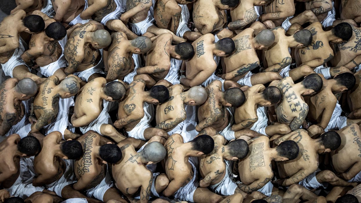 Gang members wait to be taken to their cell after 2000 gang members were transferred to the Terrorism Confinement Center, in Tecoluca, El Salvador. Handout distributed March 15, 2023.