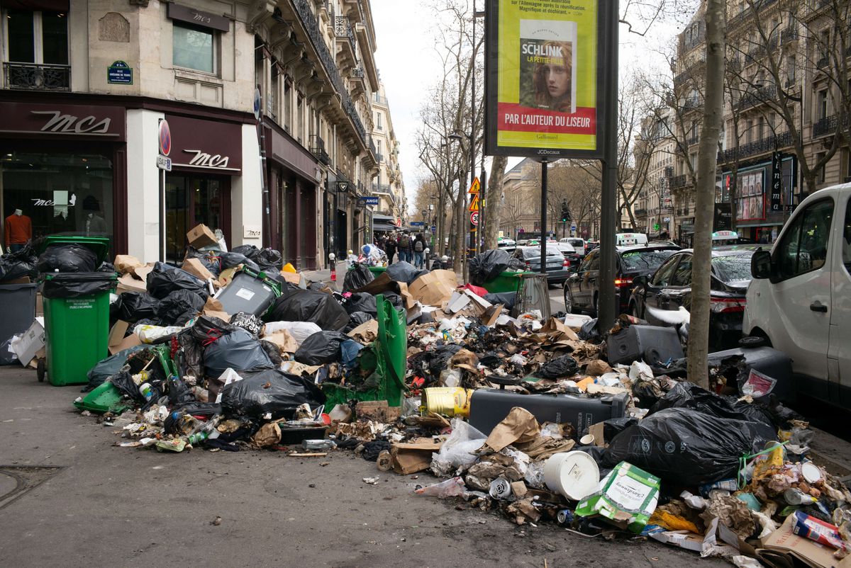 Garbage bags that have been piling up on the pavement as waste collectors are on strike since March 6 to protest against the French government's proposed pensions reform, in Paris on March 27, 2023.