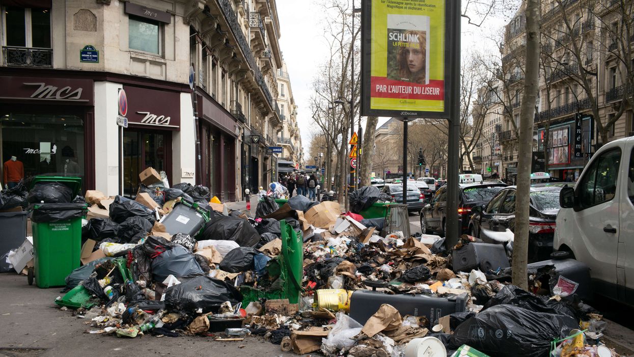Garbage bags that have been piling up on the pavement as waste collectors are on strike since March 6 to protest against the French government's proposed pensions reform, in Paris on March 27, 2023.