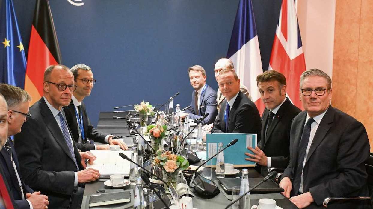 German Chancellor Friedrich Merz, French President Emmanuel Macron and British Prime Minister Keir Starmer sit at the start of the E-3 meeting in Munich, Germany, on February 13, 2026.