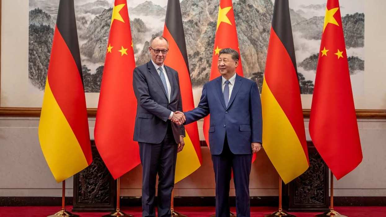 German Chancellor Friedrich Merz shakes hands with Chinese President Xi Jinping at the state guesthouse, in Beijing, China, February 25, 2026.
