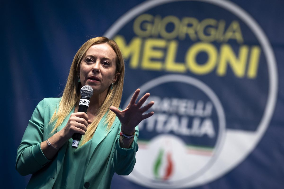 Giorgia Meloni, leader of Italian far-right party Brothers of Italy, gestures during a campaign rally in Turin.
