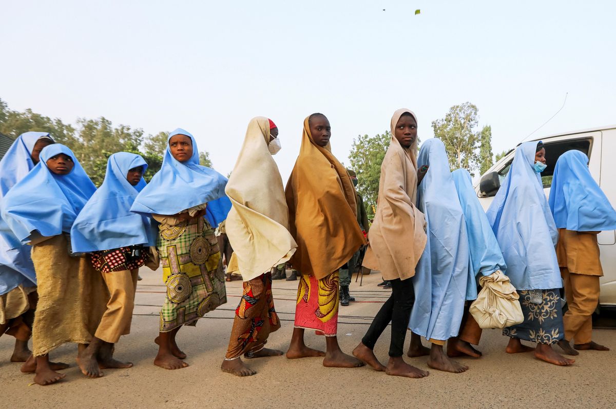 Girls who were kidnapped from a boarding school in the northwest Nigerian state of Zamfara walk in line after their release, in Zamfara, Nigeria March 2, 2021