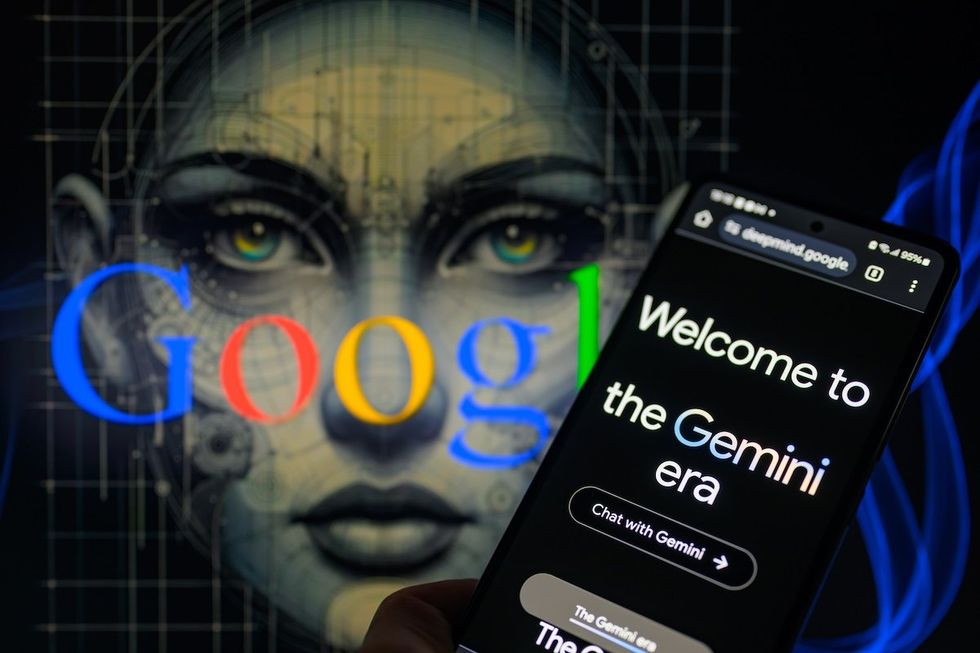 ​Google's Gemini home page displayed on a smartphone in a photo illustration.  