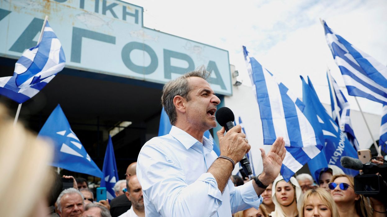 Greek PM Kyriakos Mitsotakis addresses supporters during a pre-election rally by the island of Salamina.
