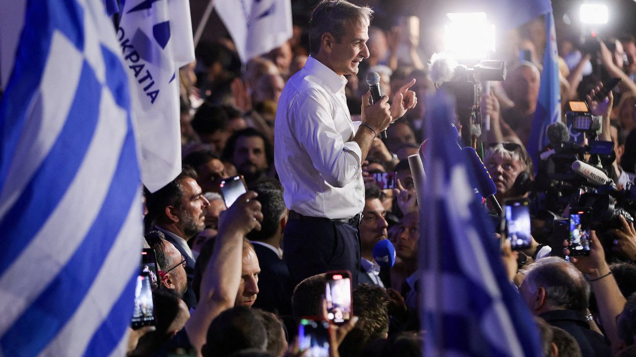 Greek PM Kyriakos Mitsotakis speaks to supporters outside his New Democracy party's headquarters in Athens.