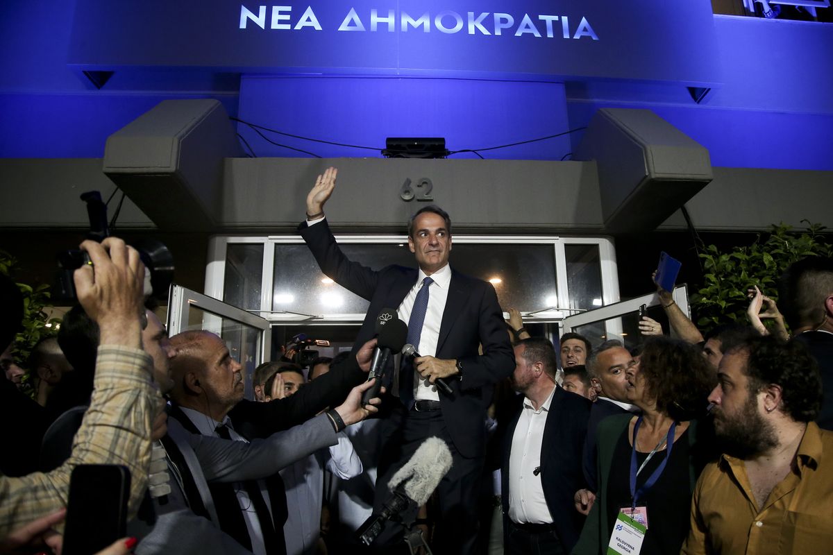 Greek Prime Minister Kyriakos Mitsotakis saluting supporters