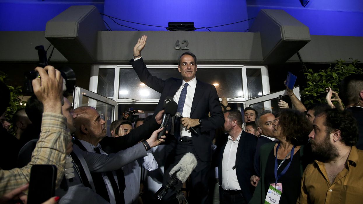 Greek Prime Minister Kyriakos Mitsotakis saluting supporters