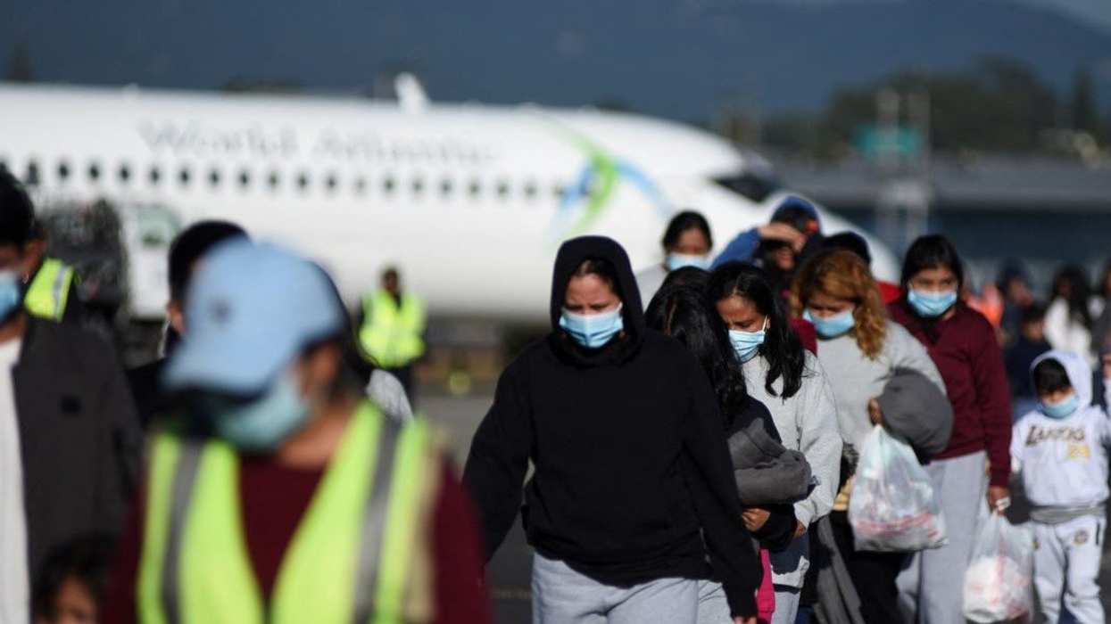 Guatemalan migrants walk after arriving at La Aurora Air Force Base on a deportation flight from the U.S., in Guatemala City, Guatemala, December 27, 2024.