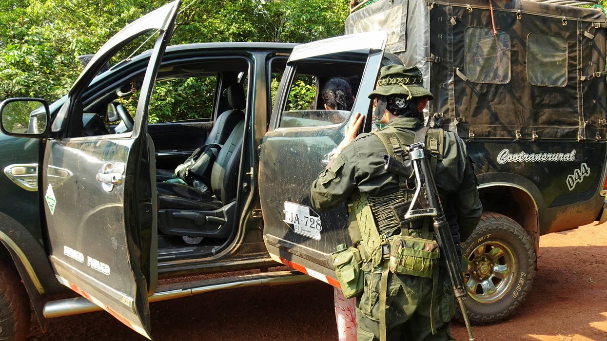 Guerrillas of the Central General Staff (EMC), a faction of the FARC that rejected the 2016 peace agreement and continued the armed struggle, inspect vehicles at a checkpoint installed on a highway in the Llanos del Yari, Colombia April 12, 2024.