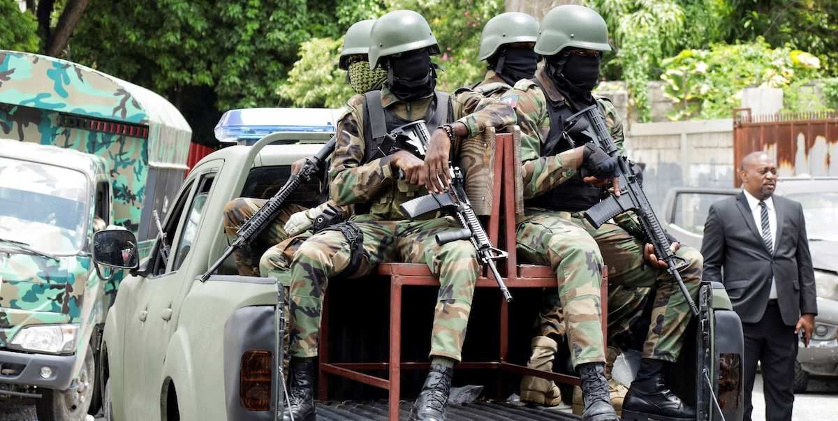 Haitian soldiers keep a watch outside the venue where businessman Laurent Saint-Cyr is set to be designated as president of Haiti's Transitional Presidential Council (CPT), in Port-au-Prince, Haiti, August 7, 2025. ​
