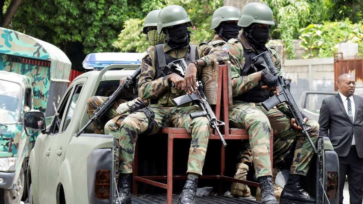 Haitian soldiers keep a watch outside the venue where businessman Laurent Saint-Cyr is set to be designated as president of Haiti's Transitional Presidential Council (CPT), in Port-au-Prince, Haiti, August 7, 2025. 