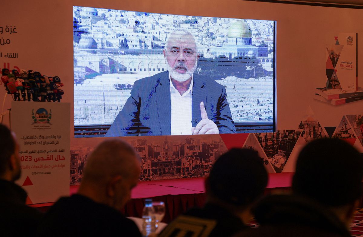 ​Hamas leader, Ismail Haniyeh, speaks in a pre-recorded message shown on a screen during a press event for Al Quds International Institution in Beirut, Lebanon February 28, 2024. 