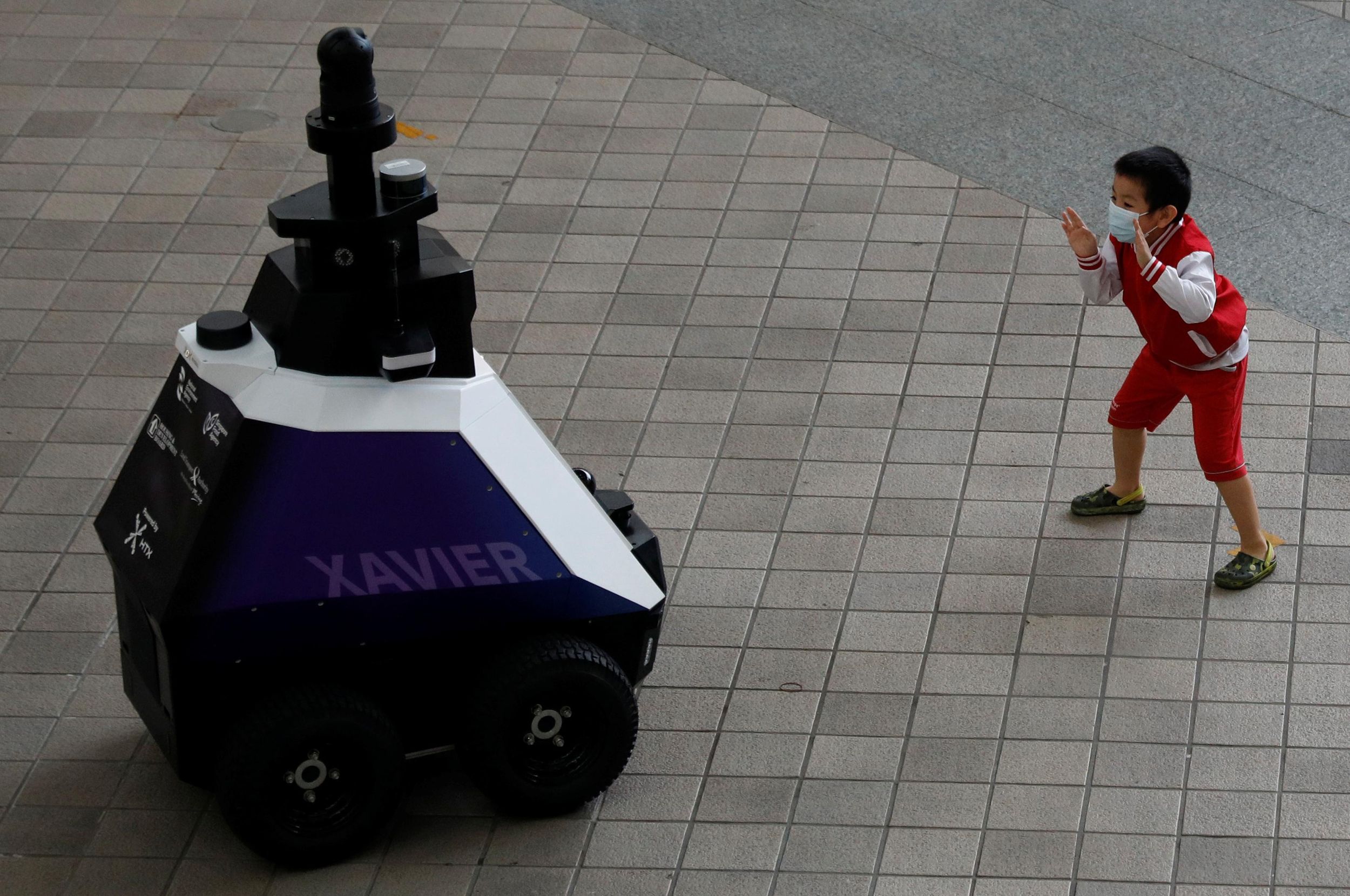 Hard Numbers: Robot cops in Singapore, malaria vaccine arrives, Russian COVID deaths soar, EU slow-walks Balkan hopefuls