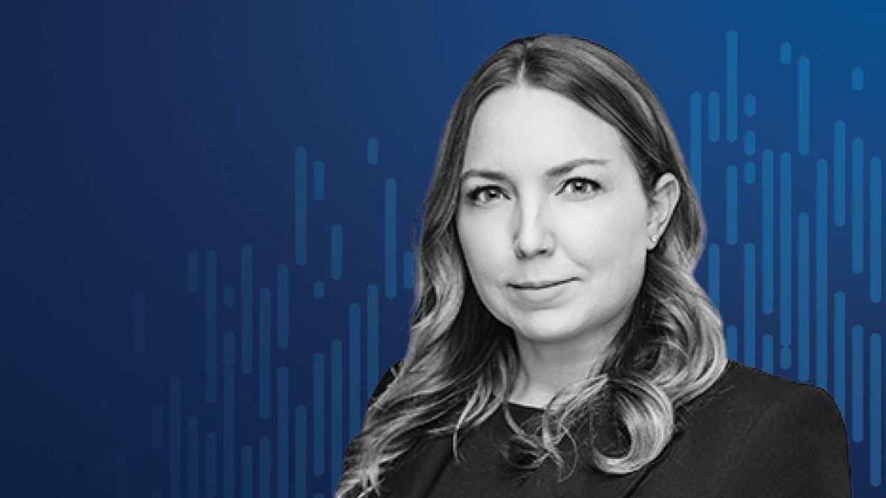 Headshot of a woman against a blue background